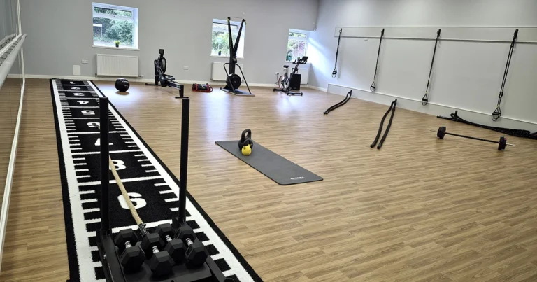 East Kilbride Community Fitness equipment is set out in a small hall
